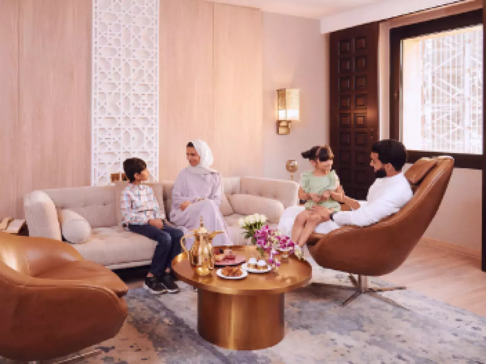 Family sitting in a hotel room